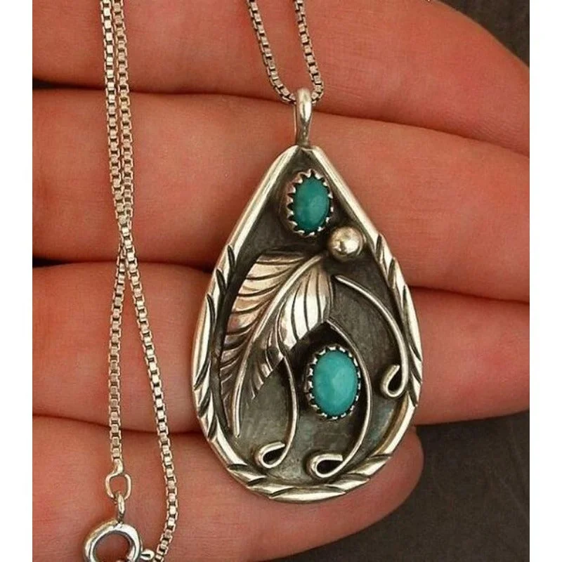 Wholesale Inlaid Turquoise Retro Dyed Black Feather Alloy Pendants